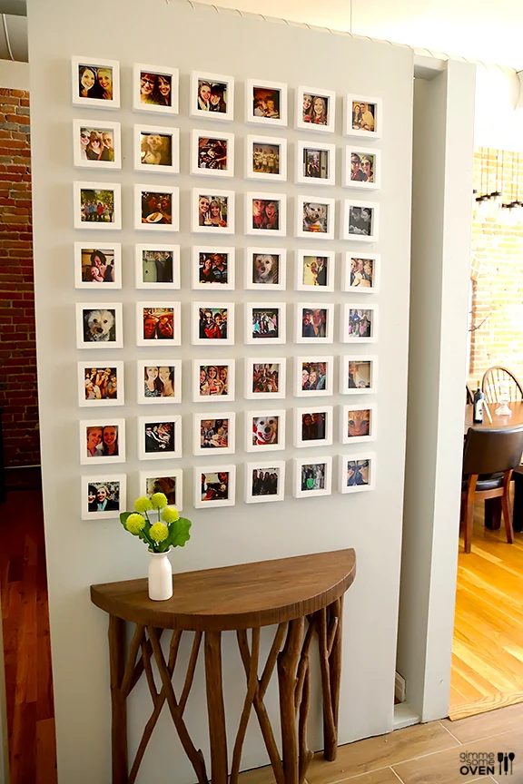 Instagram frame wall -- clearly cool half-circle branch console table, too! Bekob