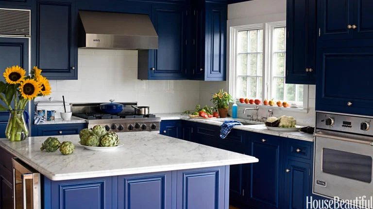 Cobalt blue kitchen with marble countertops via House striking