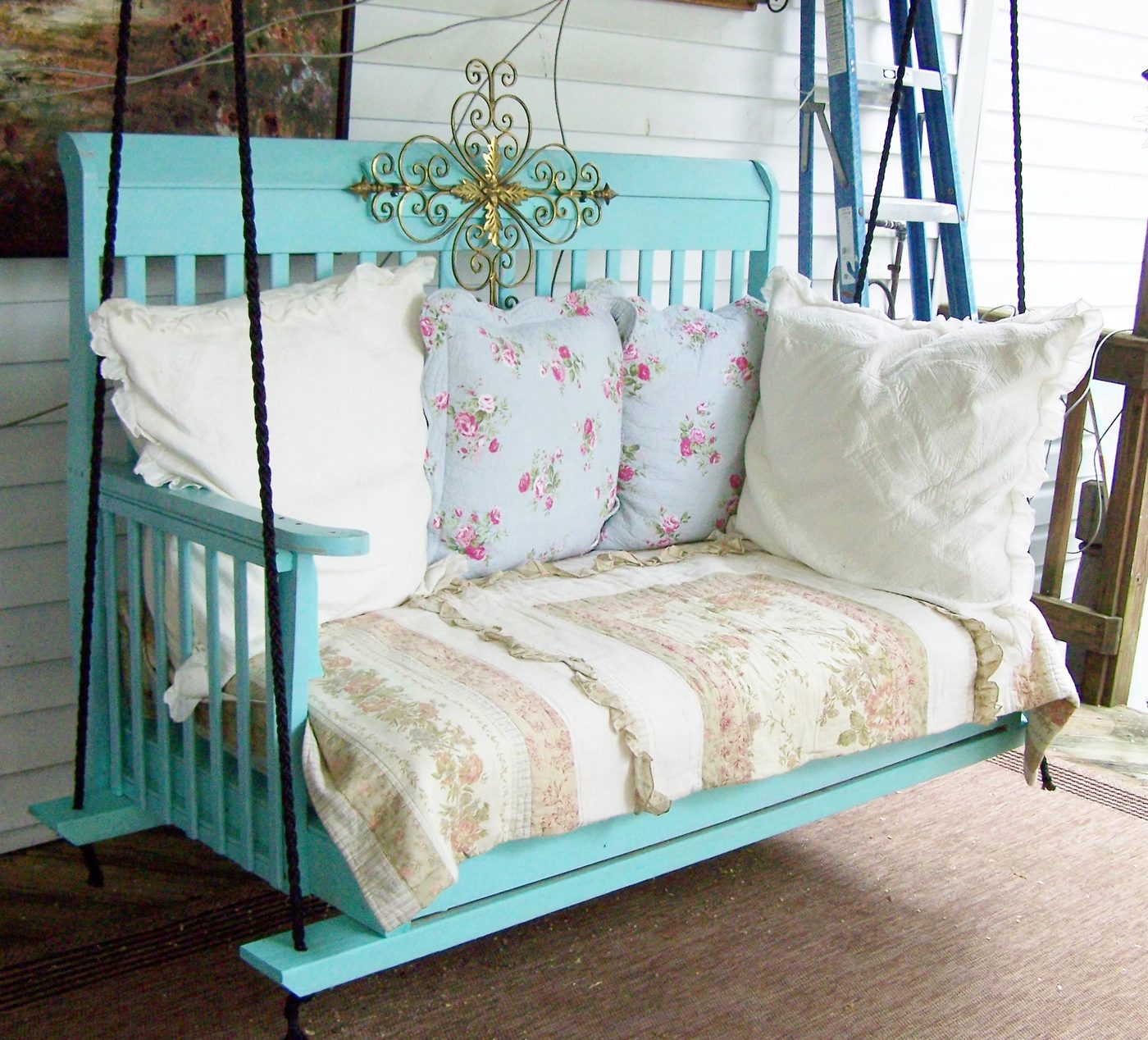 upcycled porch swing made from an old crib