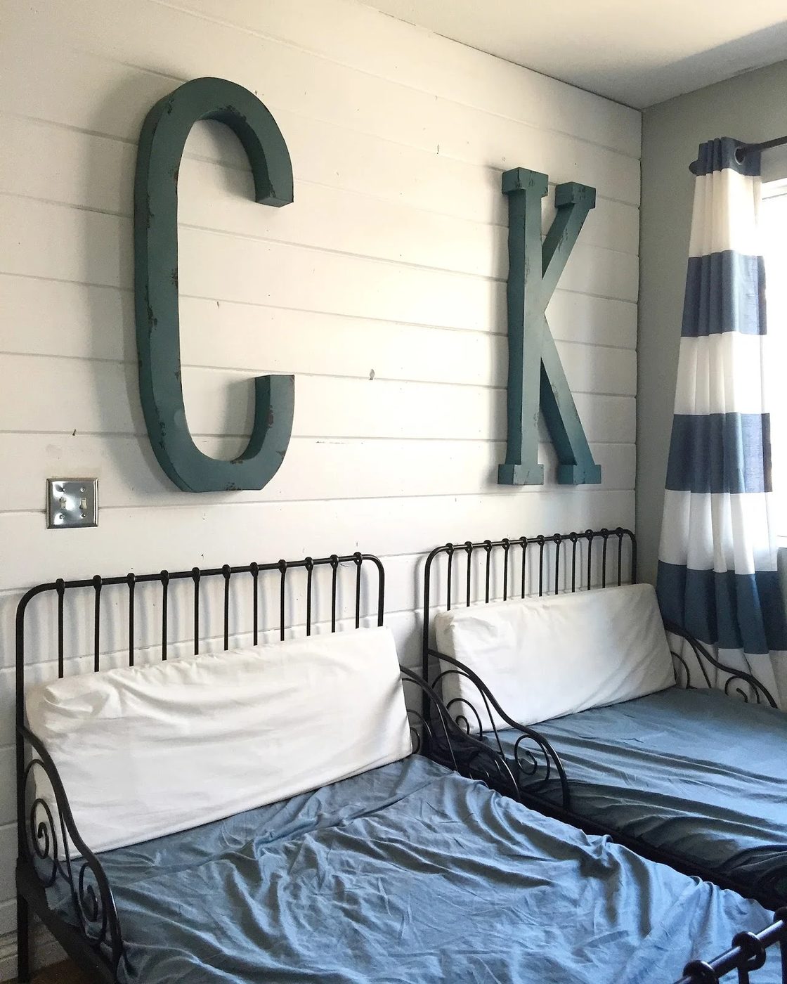 big kids room with iron beds, shiplap, and oversized monogram, Mini House Mighty Hearts