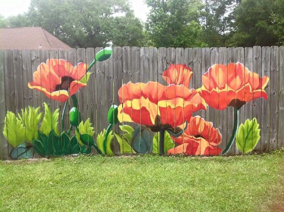 striking fence mural by Lori Anselmo Gomez in Pearl River, Louisiana