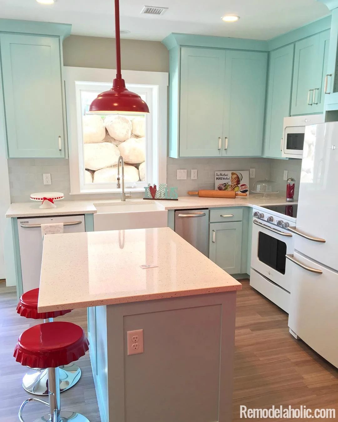clearly cute retro kitchen with light blue cabinets and red fixtures. LOVE IT! @Bekob