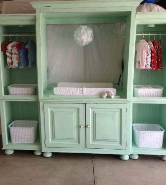 turn an old entertainment center into a changing station for the nursery