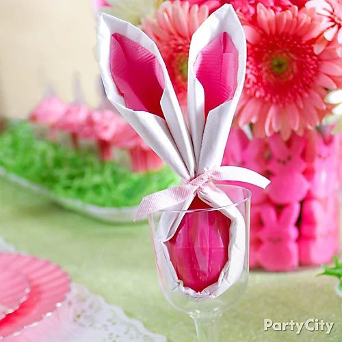 Use napkins and an egg to make a cute Easter bunny, great for Easter dinner! via Party City