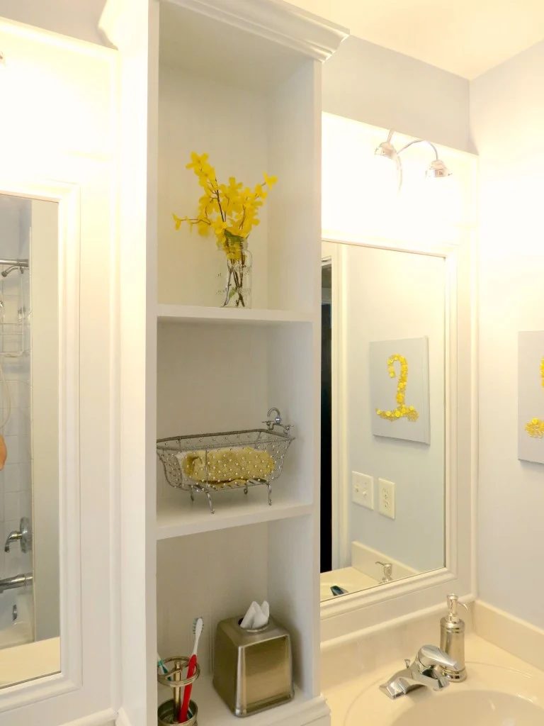 Bathroom update and makeover with shelving between two mirrors