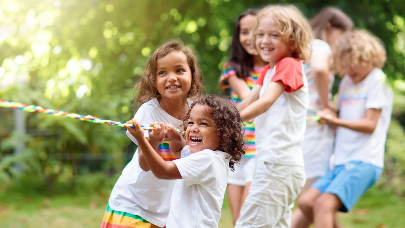 Kids Playing At The Backyard