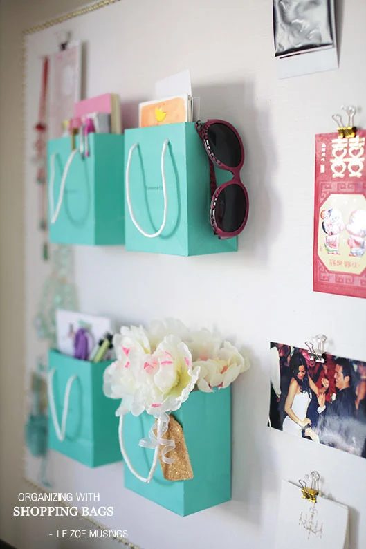 shopping bags as wall organizers (lezoemusings)