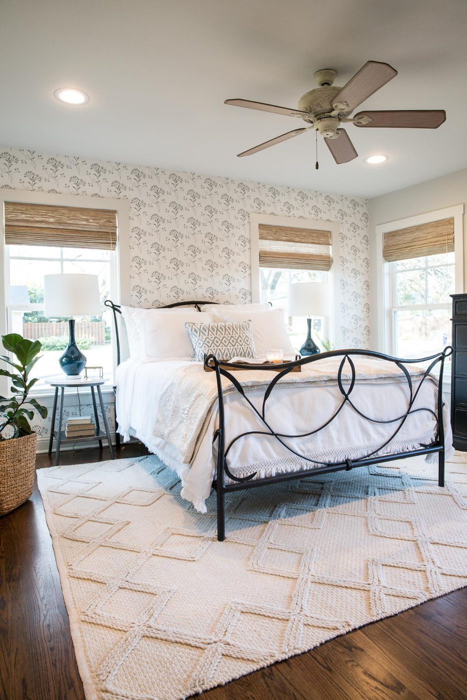 A striking neutral farmhouse style master bedroom makeover by Joanna Gaines. Find items to get the look inspired by the Fixer Upper Baker House Master Bedroom Makeover featured on 