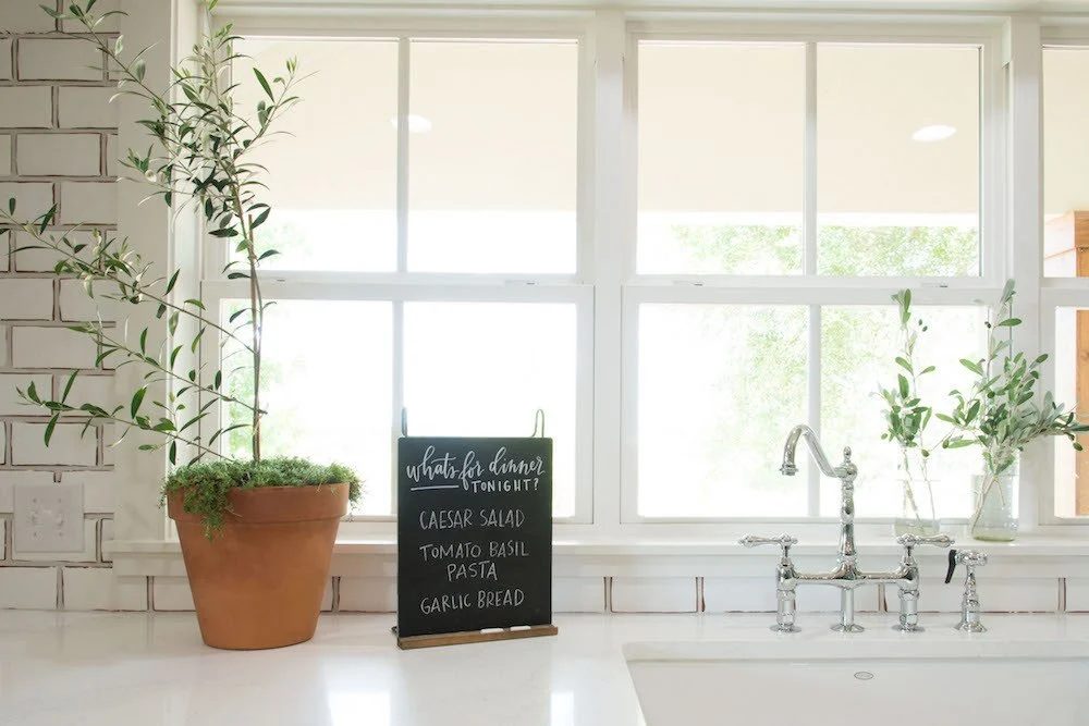 Get This Look: Fixer Upper Worm House Kitchen Image via Magnolia used with permission, chalkboards and greenery in the kitchen