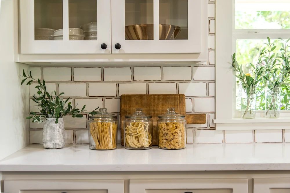 Get This Look: Fixer Upper Worm House Kitchen Image via Magnolia used with permission, striking and functional glass canisters