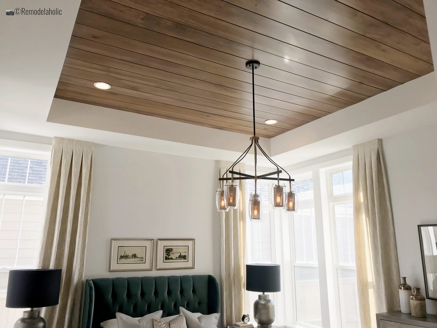 SLPH Model Home 1 Holmes Homes with wood ceiling planks, green headboard and more!