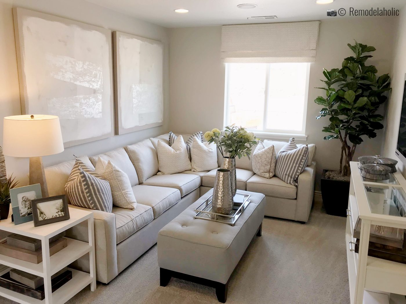Cut little living room with shelf storage end table. SLPH 2018 Home 12 Richmond American Homes, Photo by Bekob