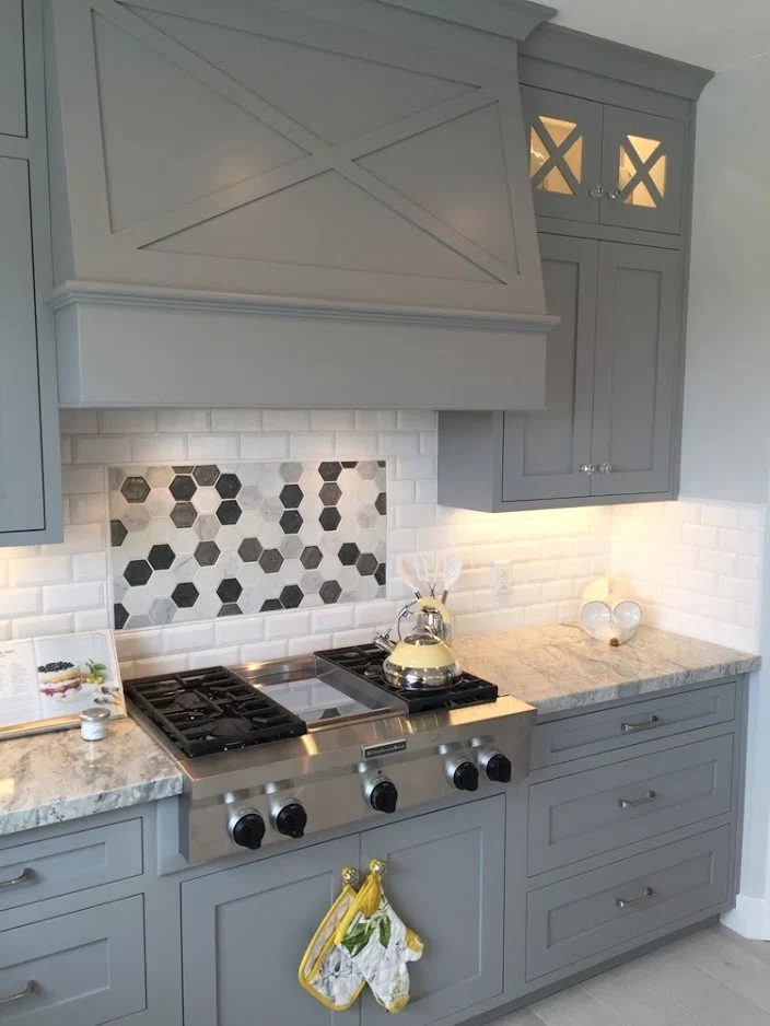striking modern kitchen with gray cabinets, contrast tile backsplash, and marble countertops. Get this look with tips and product sources from #Bekob #getthislook