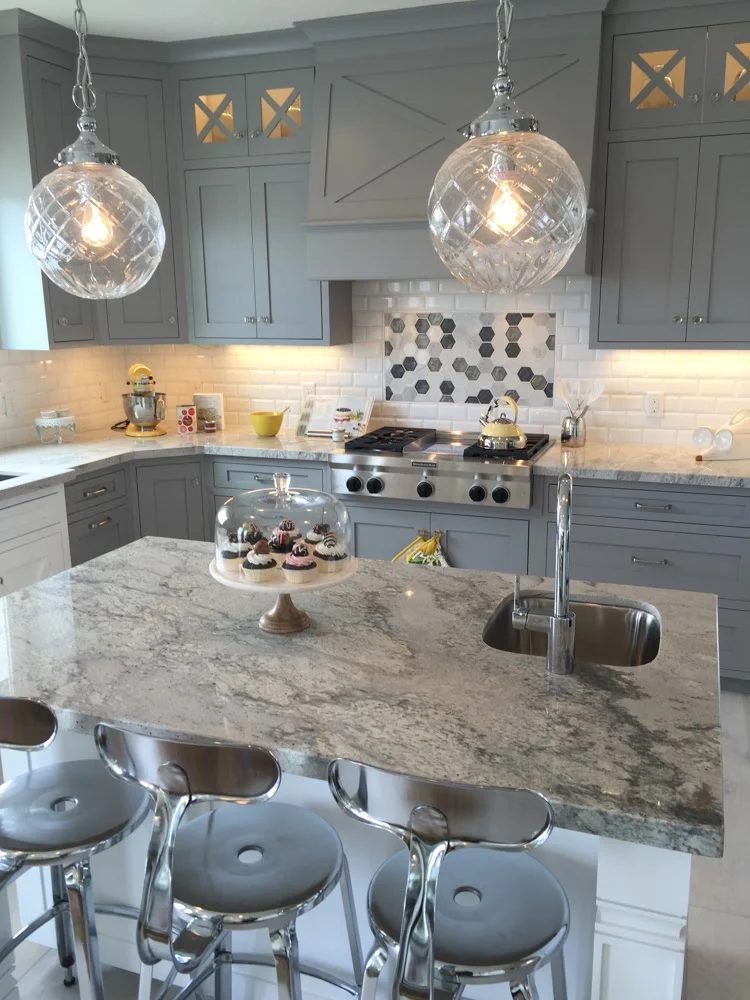 Get This Look: striking gray kitchen cabinets with marble countertop, white kitchen island, and hanging globe pendants. Tips and product sources at #Bekob