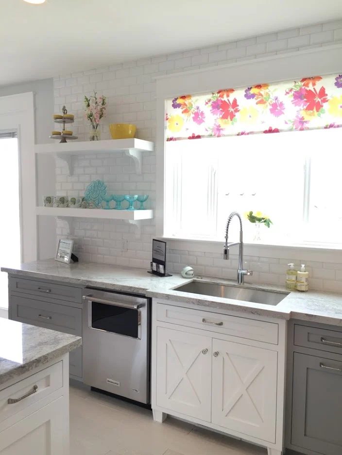 Sophisticated gray kitchen cabinets, with a white farmhouse style accent cabinet for the sink, and colorful decor #Bekob #getthislook