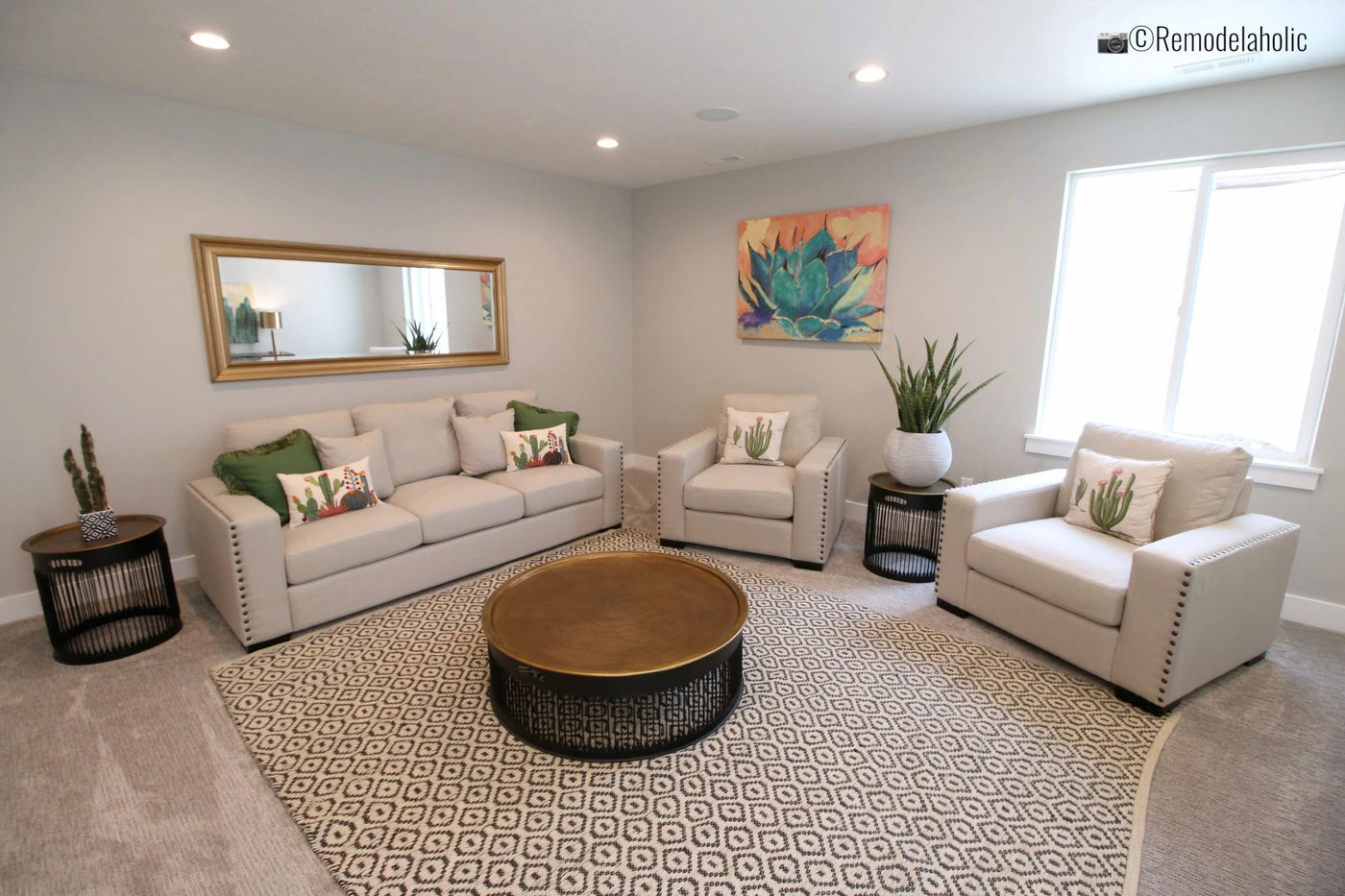 Lovely use of end tables and coffee table in a living room. SLPH 2018 Home 10 Hardrock Homes, Photo by Bekob