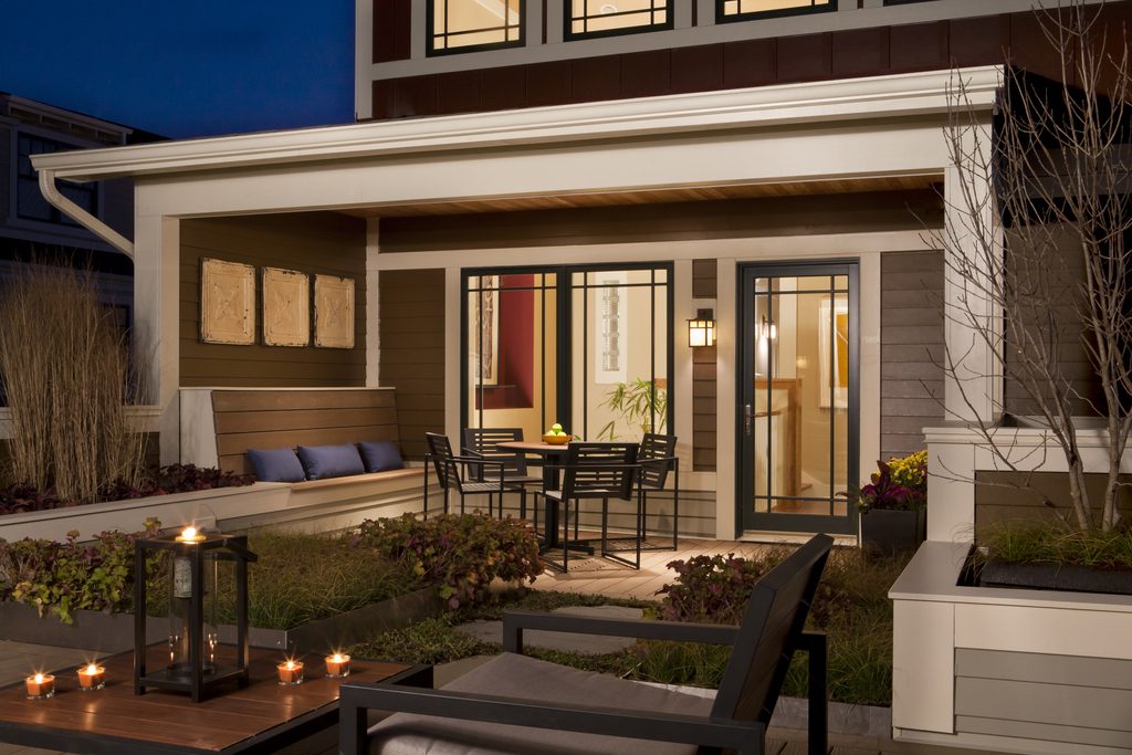 lovely porch with built-in bench seating for entertaining and outdoor dining