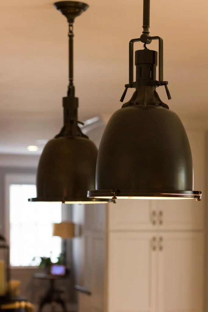 industrial brass lighting in a white kitchen renovation