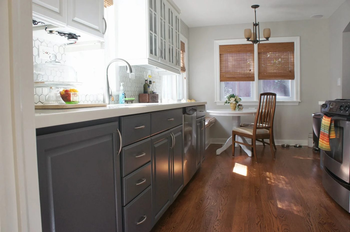 gray and white kitchen with breakfast nook banquette, LoveLee Homemaker featured on Bekob