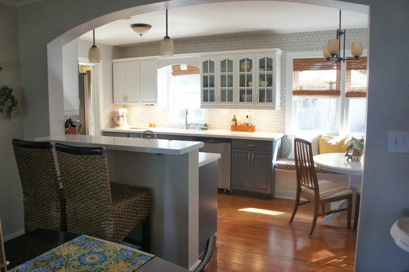 gray and white painted kitchen with hexagon tile, breakfast banquette and pendant lights, LoveLee Homemaker featured on Bekob