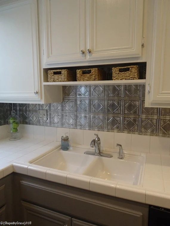 gray and white kitchen with tin tile backsplash, Shaped By Grace featured on Bekob