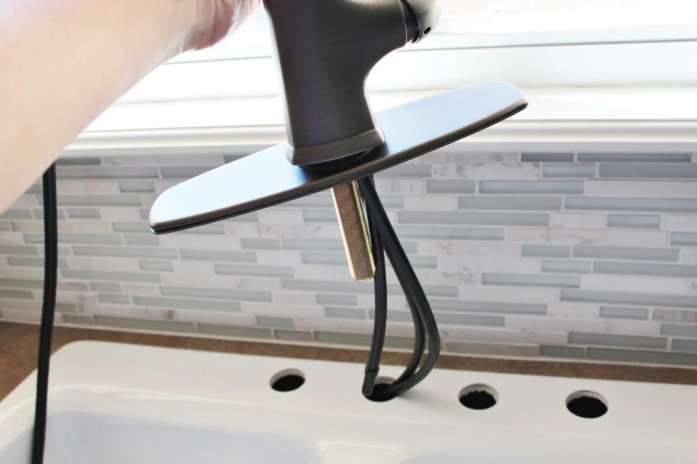 installing a new faucet, House For Five featured on Bekob