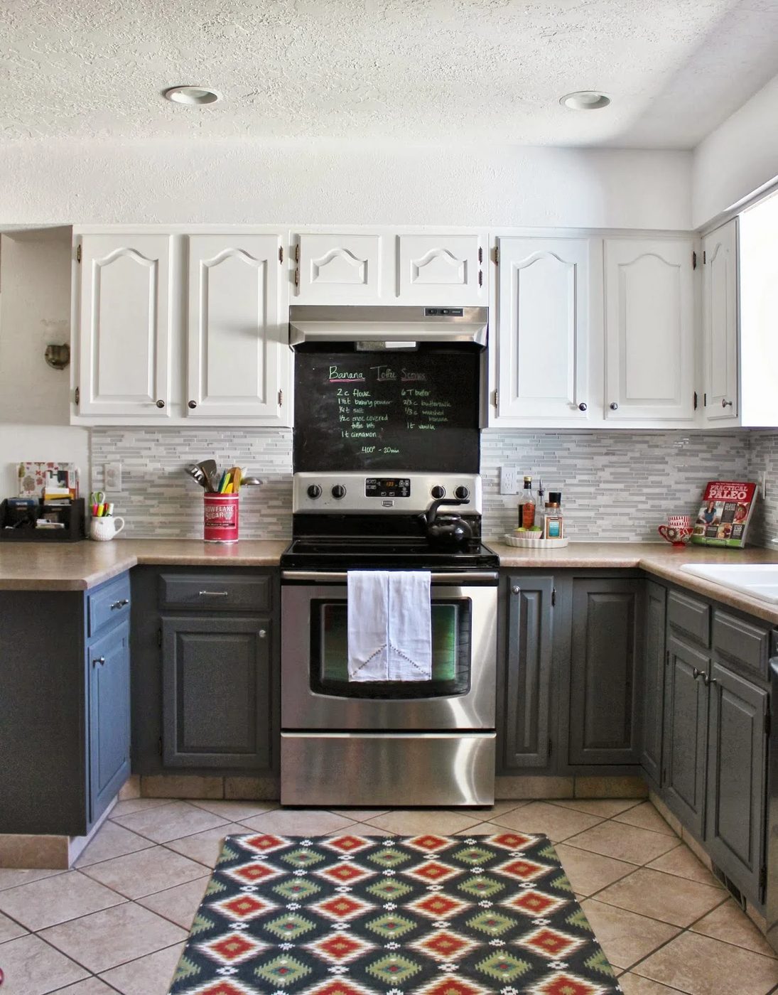grey and white kitchen with tile backsplash and chalkboard, House For Five featured on Bekob