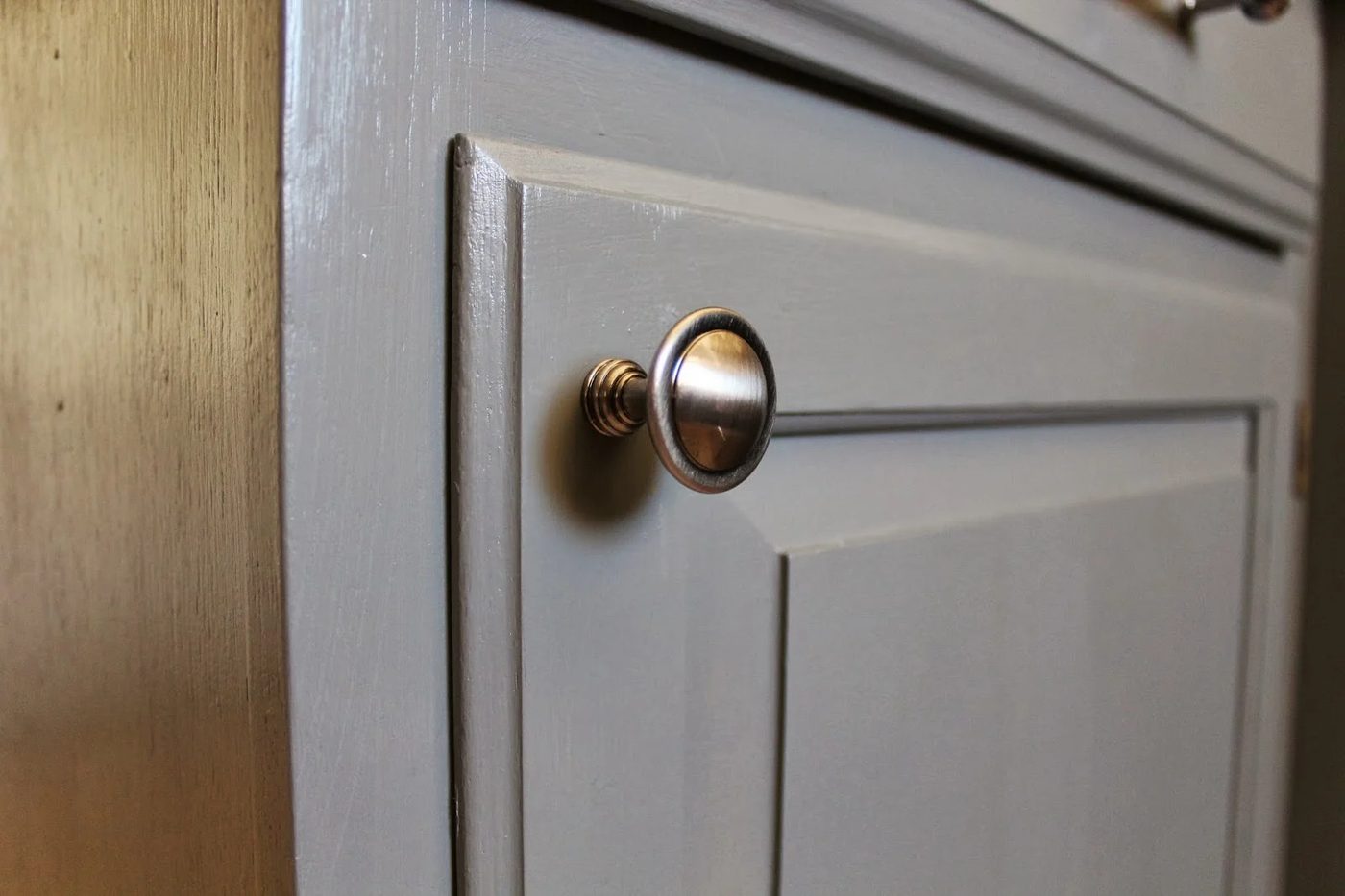 grey and white kitchen cabinets with polished pewter knobs, House For Five featured on Bekob