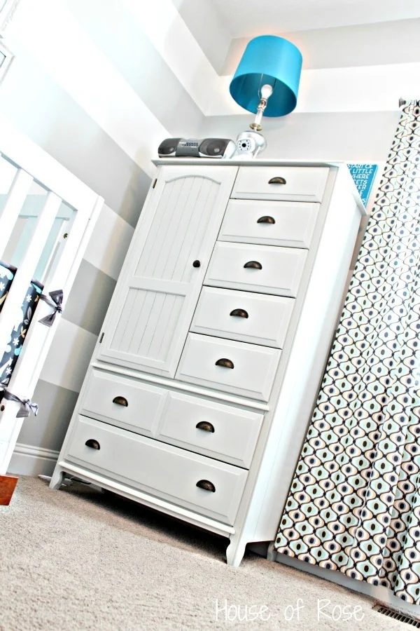 Dresser And Striped Wall