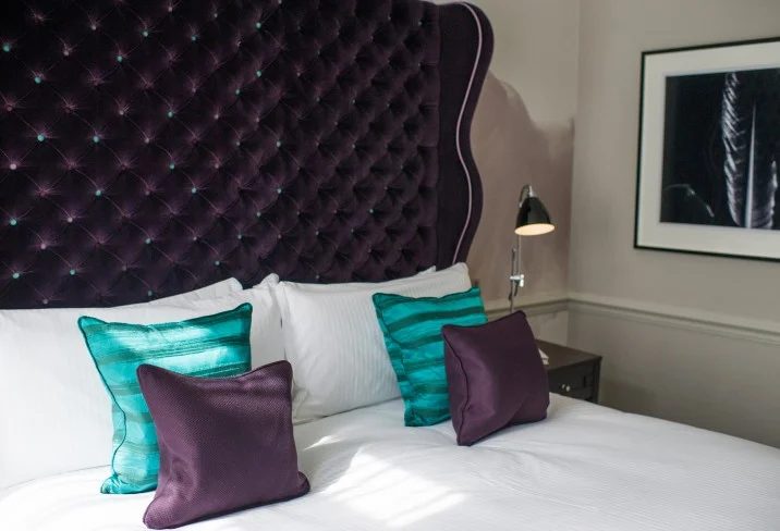 tufted scalloped wingback headboard in black via DecorPad