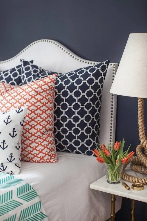 white and nailhead camelback upholstered headboard via DecorPad