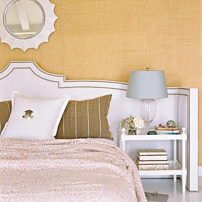 extra wide keystone headboard with arms and nailhead trim via Coastal Living
