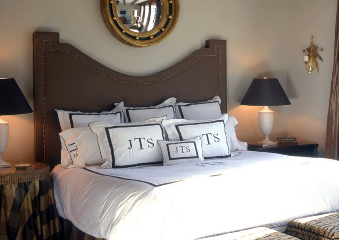 reverse arched headboard with nailhead trim via DecorPad
