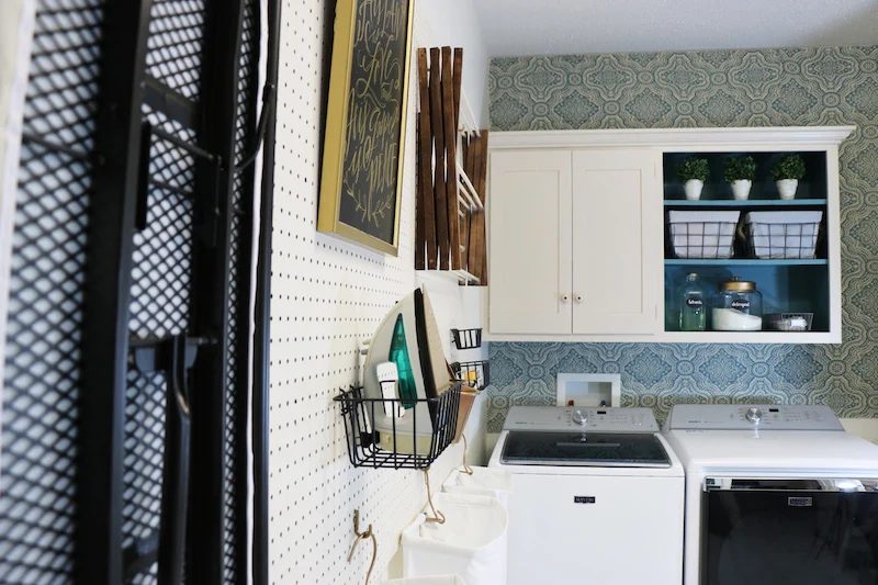 It's straightforward to hang pegboard for an straightforward and versatile laundry room storage solution