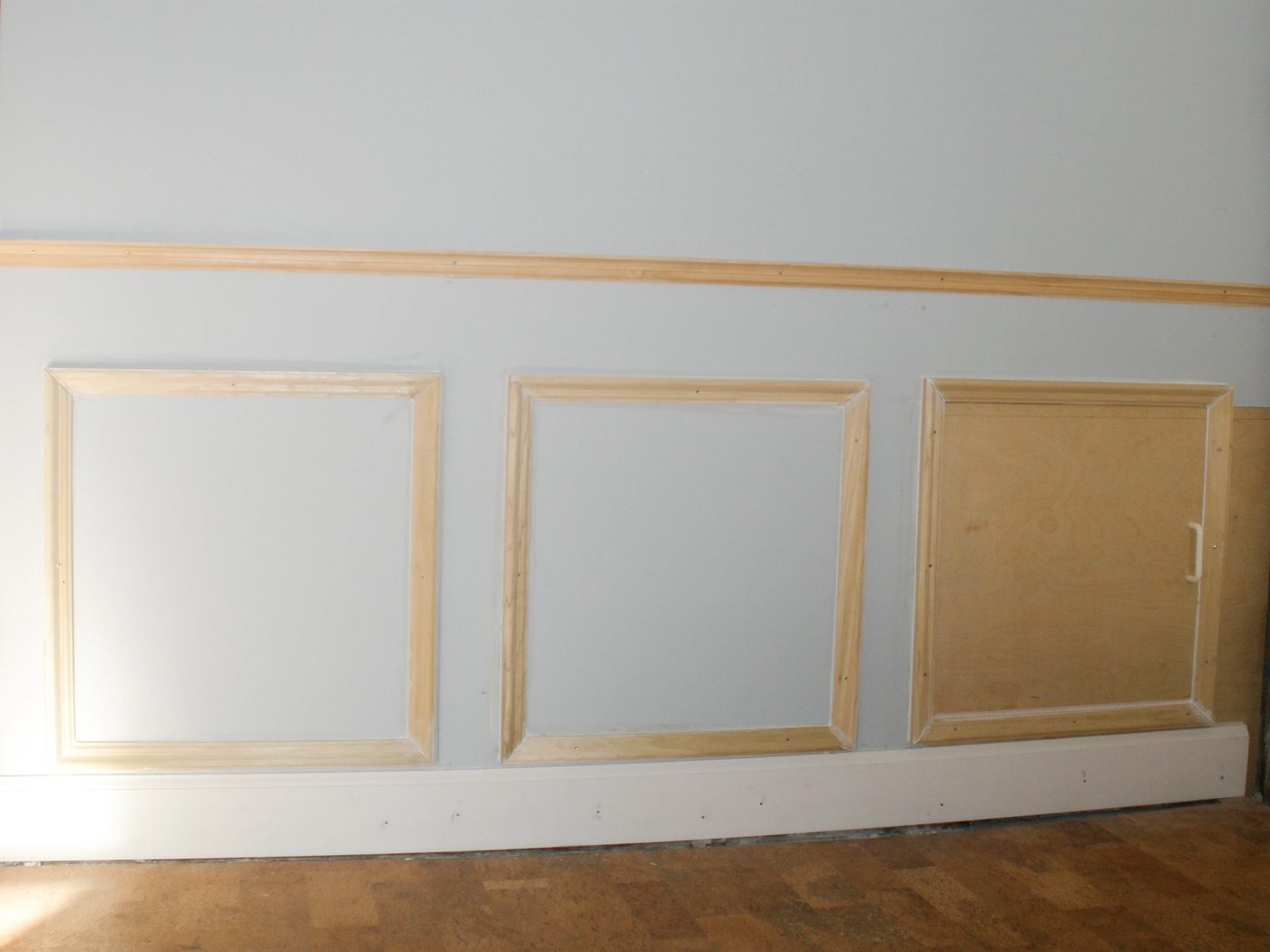 Hiding plumbing access with wainscoting-3