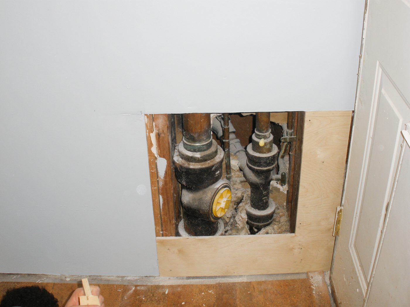Hiding plumbing access with wainscoting-2