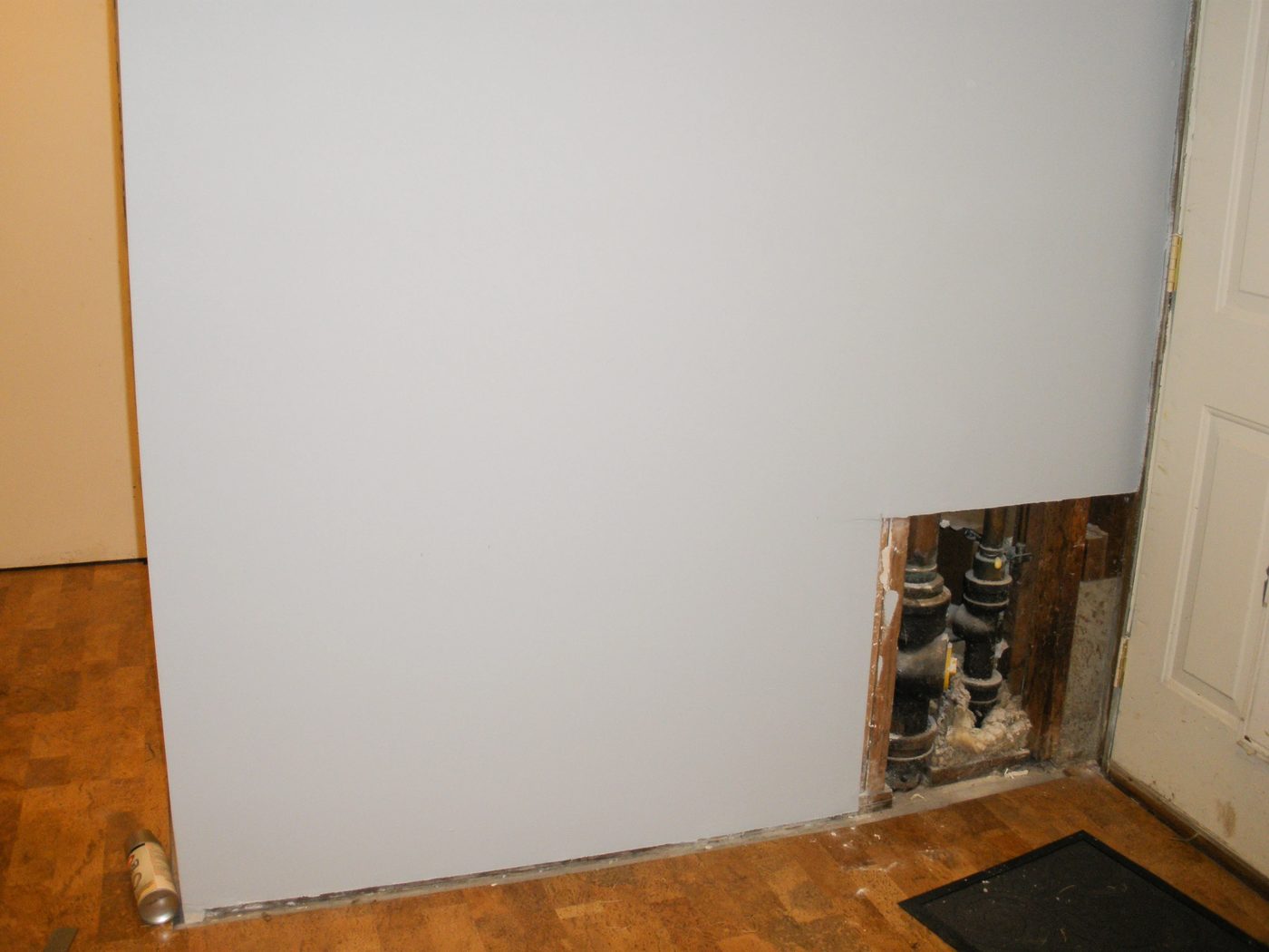 Hiding plumbing access with wainscoting
