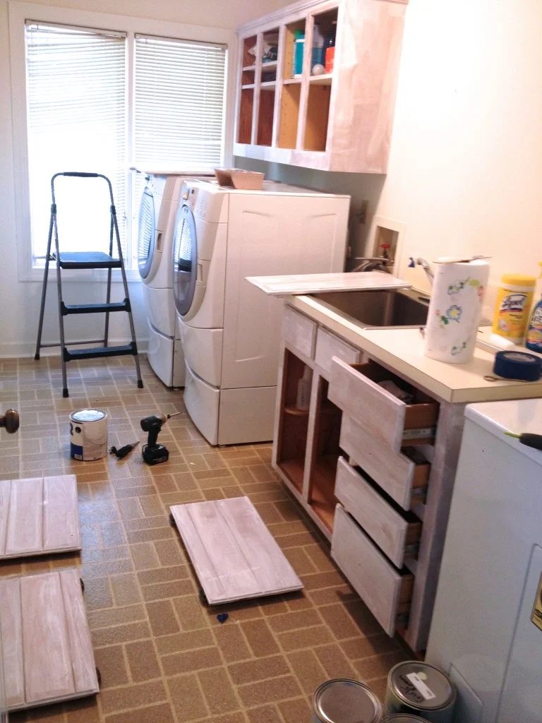 low cost laundry room makeover with painted cabinets, featured on Bekob