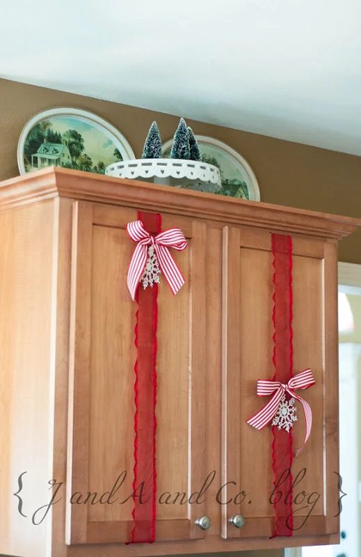 straightforward Christmas decor for kitchen cabinets - J and A and Co via @Bekob