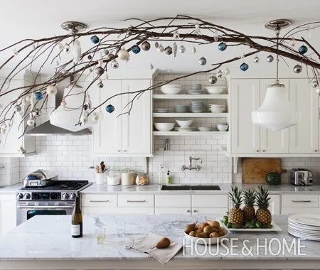 branches and ornaments to decorate overhead for Christmas - House and Home via @Bekob