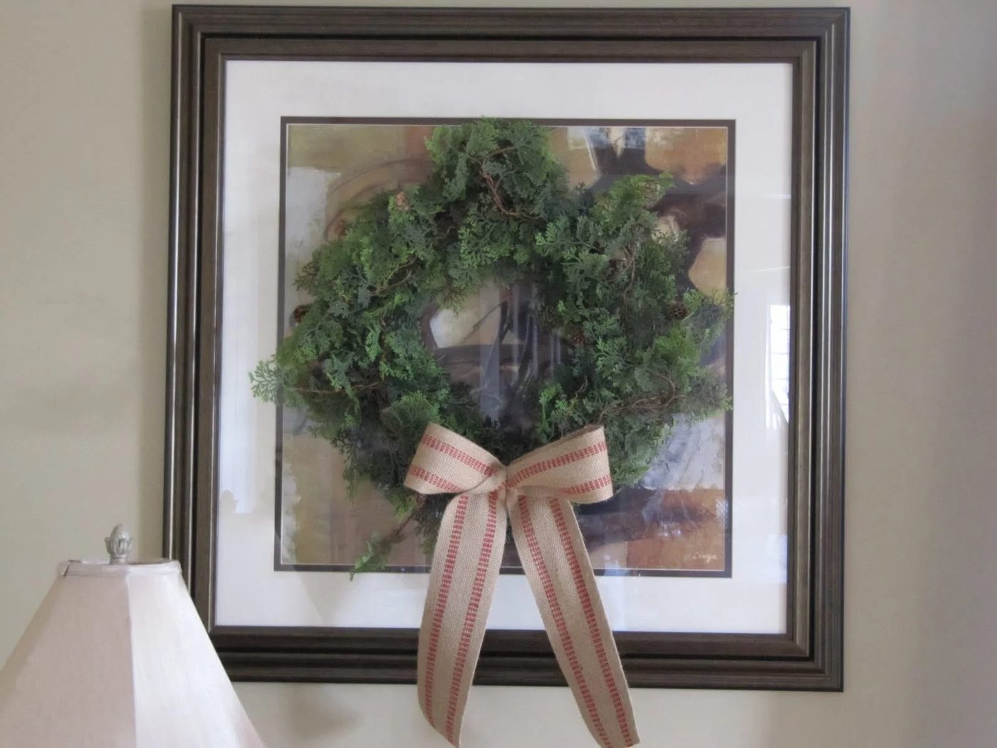 hang a wreath on framed art - Sew Many Ways via @Bekob
