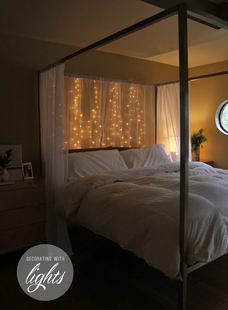 hang christmas lights behind a sheer curtain for holiday headboard - Warm Hot Chocolate via @Bekob