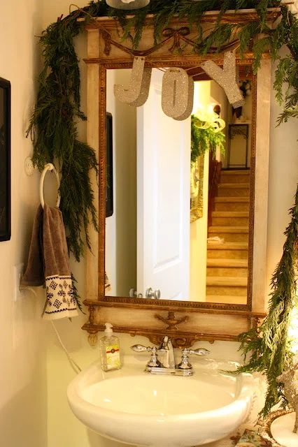 evergreen boughs and garland for Christmas bathroom decor - My Sweet Savannah via @Bekob