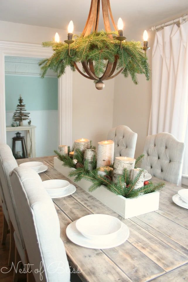 evergreen boughs in the dining room chandelier - Nest of Bliss via @Bekob