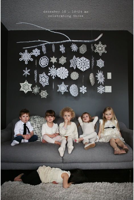 hanging paper snowflakes from a branch for a winter mobile art - Lila Was Here via @Bekob