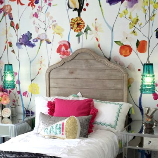 Floral Wallpaper With Wood Headboard And White Sheets And Colorful Pillows