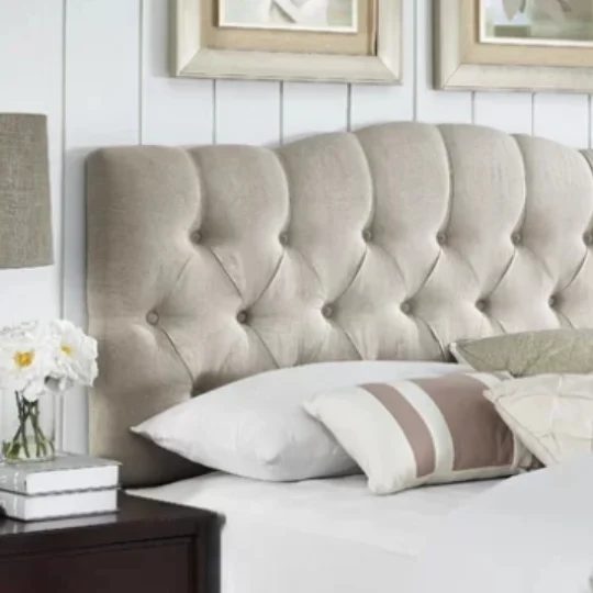 Tufted Cream Headboard With White Planked Wall Behind