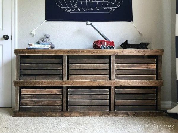 Stained Wooden Cubbies With Wooden Boxes In Each Cubby