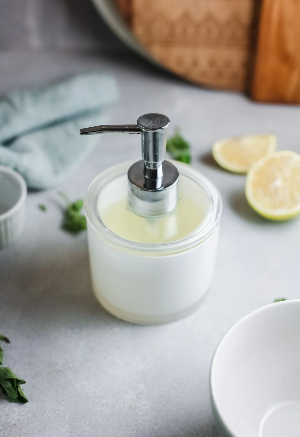 Dispenser with limes in the background
