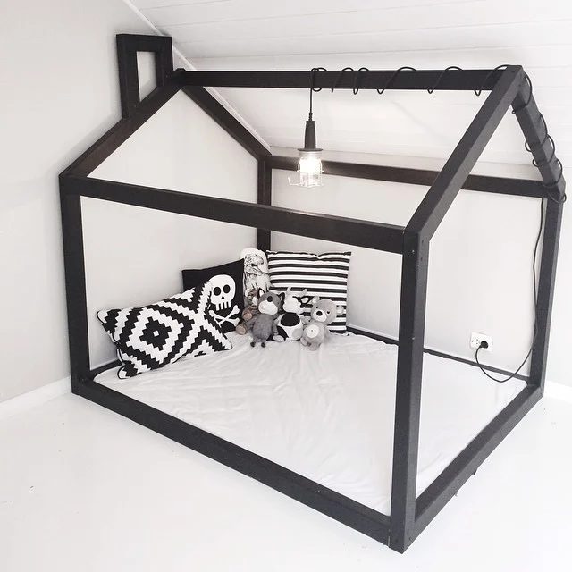 direct black and white floor bed playhouse reading corner setup via karohuseb